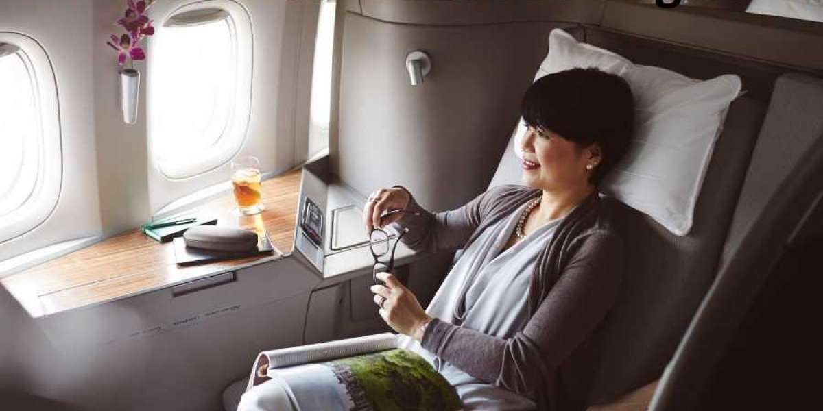 What are the steps for upgrading my seat on Cathay Pacific?